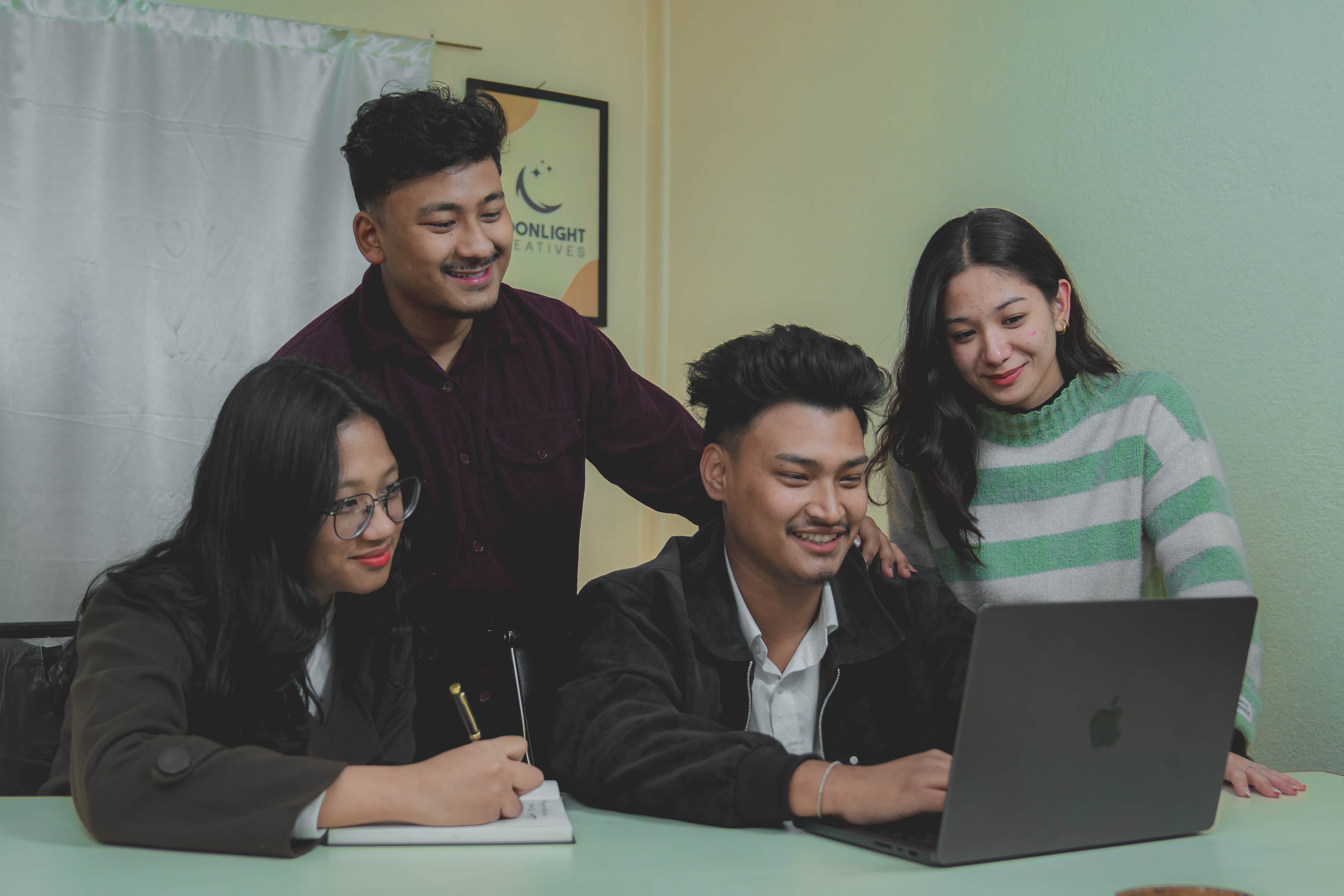 Moonlight Creatives team collaborating in a meeting