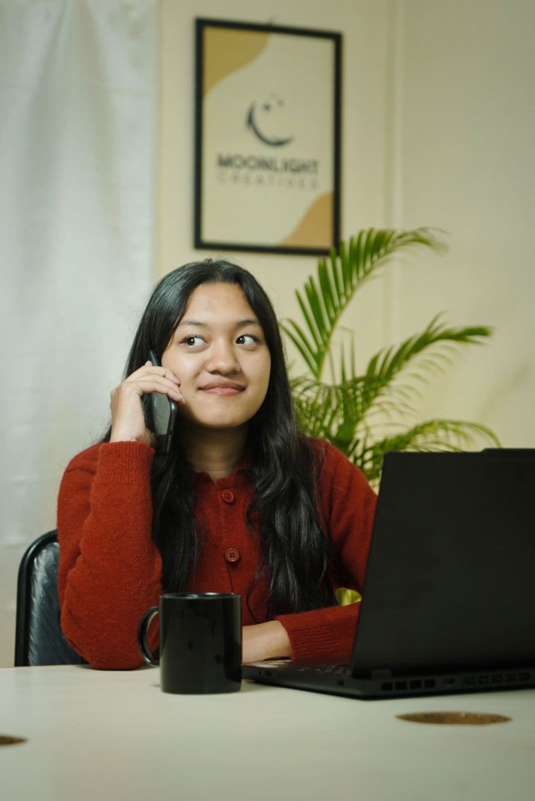 Moonlight Creatives team member working on a laptop